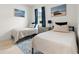 Cozy guest bedroom with twin beds and neutral decor at 12739 Rainwashed Loop, Parrish, FL 34219