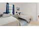 Well-lit guest bedroom with twin beds and neutral decor at 12739 Rainwashed Loop, Parrish, FL 34219