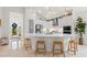 Modern kitchen with stainless steel appliances and white cabinetry at 12739 Rainwashed Loop, Parrish, FL 34219