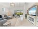 Relaxing living room featuring comfortable sectional sofa and built-in entertainment center at 12739 Rainwashed Loop, Parrish, FL 34219
