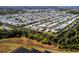 Aerial image showcasing a waterfront manufactured home community and solar panels at 170 S Saint Thomas Cir, Apollo Beach, FL 33572