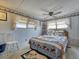 Bedroom with nautical decor, ceiling fan and carpet flooring at 170 S Saint Thomas Cir, Apollo Beach, FL 33572