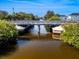 Aerial of a canal featuring a bridge and lush greenery at 170 S Saint Thomas Cir, Apollo Beach, FL 33572