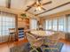 Charming dining area with a round table, four chairs, and hardwood floors at 170 S Saint Thomas Cir, Apollo Beach, FL 33572