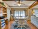 Dining area with a round table, four chairs, and hardwood floors at 170 S Saint Thomas Cir, Apollo Beach, FL 33572