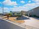 House exterior shows a yellow single-wide mobile home with carport at 170 S Saint Thomas Cir, Apollo Beach, FL 33572