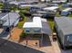 Single-wide manufactured home with carport and landscaped yard at 170 S Saint Thomas Cir, Apollo Beach, FL 33572
