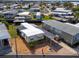 Single-wide manufactured home with carport and landscaped yard at 170 S Saint Thomas Cir, Apollo Beach, FL 33572