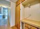Home hallway with built-in storage and wood flooring at 170 S Saint Thomas Cir, Apollo Beach, FL 33572