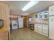 View of a kitchen with white appliances and wood cabinets at 170 S Saint Thomas Cir, Apollo Beach, FL 33572