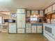 Bright kitchen featuring blue and white cabinets, and modern appliances at 170 S Saint Thomas Cir, Apollo Beach, FL 33572
