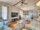 Cozy living room with sofas, armchairs, and a glass coffee table at 170 S Saint Thomas Cir, Apollo Beach, FL 33572