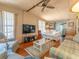 Cozy living room with sofas, armchairs, and a glass coffee table at 170 S Saint Thomas Cir, Apollo Beach, FL 33572