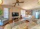 Bright living room with sofas, armchairs, and a glass coffee table at 170 S Saint Thomas Cir, Apollo Beach, FL 33572