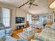 Living room with light colored couches, a coffee table, and hardwood floors at 170 S Saint Thomas Cir, Apollo Beach, FL 33572