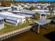 Waterfront manufactured home with private dock and seating area at 170 S Saint Thomas Cir, Apollo Beach, FL 33572