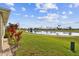 Peaceful backyard oasis overlooking a tranquil lake and golf course at 1709 Edgewater Ln, Palmetto, FL 34221