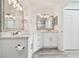 Updated bathroom with white cabinets, quartz countertops and modern fixtures at 1709 Edgewater Ln, Palmetto, FL 34221