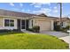 Well-maintained exterior, featuring a one-car garage and lush lawn at 1709 Edgewater Ln, Palmetto, FL 34221