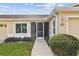 Inviting front entry with screen door and landscaped walkway at 1709 Edgewater Ln, Palmetto, FL 34221