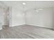 Open concept living room with gray vinyl flooring and high ceilings at 1709 Edgewater Ln, Palmetto, FL 34221