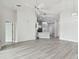Living room with gray flooring and views into the kitchen area at 1709 Edgewater Ln, Palmetto, FL 34221