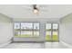Living room showcasing a lake view and ceiling fan at 1709 Edgewater Ln, Palmetto, FL 34221