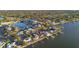 Aerial view of a waterfront neighborhood with many homes at 1836 Venetian Point Dr, Clearwater, FL 33755