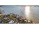 Aerial view of waterfront homes and properties with calm water and city skyline at 1836 Venetian Point Dr, Clearwater, FL 33755