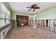 Needs renovation, bedroom with tiled floors and ceiling fan at 1836 Venetian Point Dr, Clearwater, FL 33755