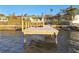 A wooden private dock extending into calm water at 1836 Venetian Point Dr, Clearwater, FL 33755