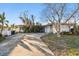 Ranch style home with carport and mature landscaping at 1836 Venetian Point Dr, Clearwater, FL 33755
