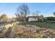 House exterior with mature landscaping at 1836 Venetian Point Dr, Clearwater, FL 33755