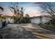 Ranch style home with carport and mature landscaping at 1836 Venetian Point Dr, Clearwater, FL 33755
