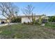 House exterior with mature landscaping at 1836 Venetian Point Dr, Clearwater, FL 33755