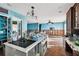 Renovation in progress, kitchen features island and ample cabinetry at 1836 Venetian Point Dr, Clearwater, FL 33755