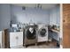 Laundry room with washer, dryer, and sink, ready for upgrades at 1836 Venetian Point Dr, Clearwater, FL 33755
