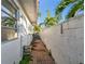 Brick walkway provides access to the side of the property at 1836 Venetian Point Dr, Clearwater, FL 33755