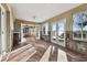 Sunroom with tiled floor and glass doors and water views at 1836 Venetian Point Dr, Clearwater, FL 33755