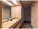 Bathroom with marble-look countertop and double doors at 2511 Dolly Bay Dr # 303, Palm Harbor, FL 34684