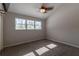 Well-lit bedroom featuring a ceiling fan and large windows at 2511 Dolly Bay Dr # 303, Palm Harbor, FL 34684