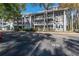 Two-story building with parking and lush landscaping at 2511 Dolly Bay Dr # 303, Palm Harbor, FL 34684