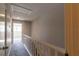 Upstairs hallway with carpeted floors and staircase at 2511 Dolly Bay Dr # 303, Palm Harbor, FL 34684