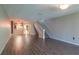 Open living room showcasing wood-look floors and kitchen at 2511 Dolly Bay Dr # 303, Palm Harbor, FL 34684