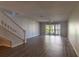 Living room featuring wood-look floors and balcony access at 2511 Dolly Bay Dr # 303, Palm Harbor, FL 34684