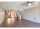 Spacious living room with wood-look floors and kitchen view at 2511 Dolly Bay Dr # 303, Palm Harbor, FL 34684
