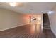 Living area with wood-look floors and a staircase at 2511 Dolly Bay Dr # 303, Palm Harbor, FL 34684
