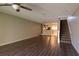 Living room with laminate flooring and a staircase at 2511 Dolly Bay Dr # 303, Palm Harbor, FL 34684
