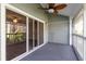 Relaxing screened porch with ceiling fan and wooded view at 2511 Dolly Bay Dr # 303, Palm Harbor, FL 34684