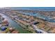 Aerial view of townhome community near water, marina, and tennis courts at 262 Madeira Cir, Tierra Verde, FL 33715